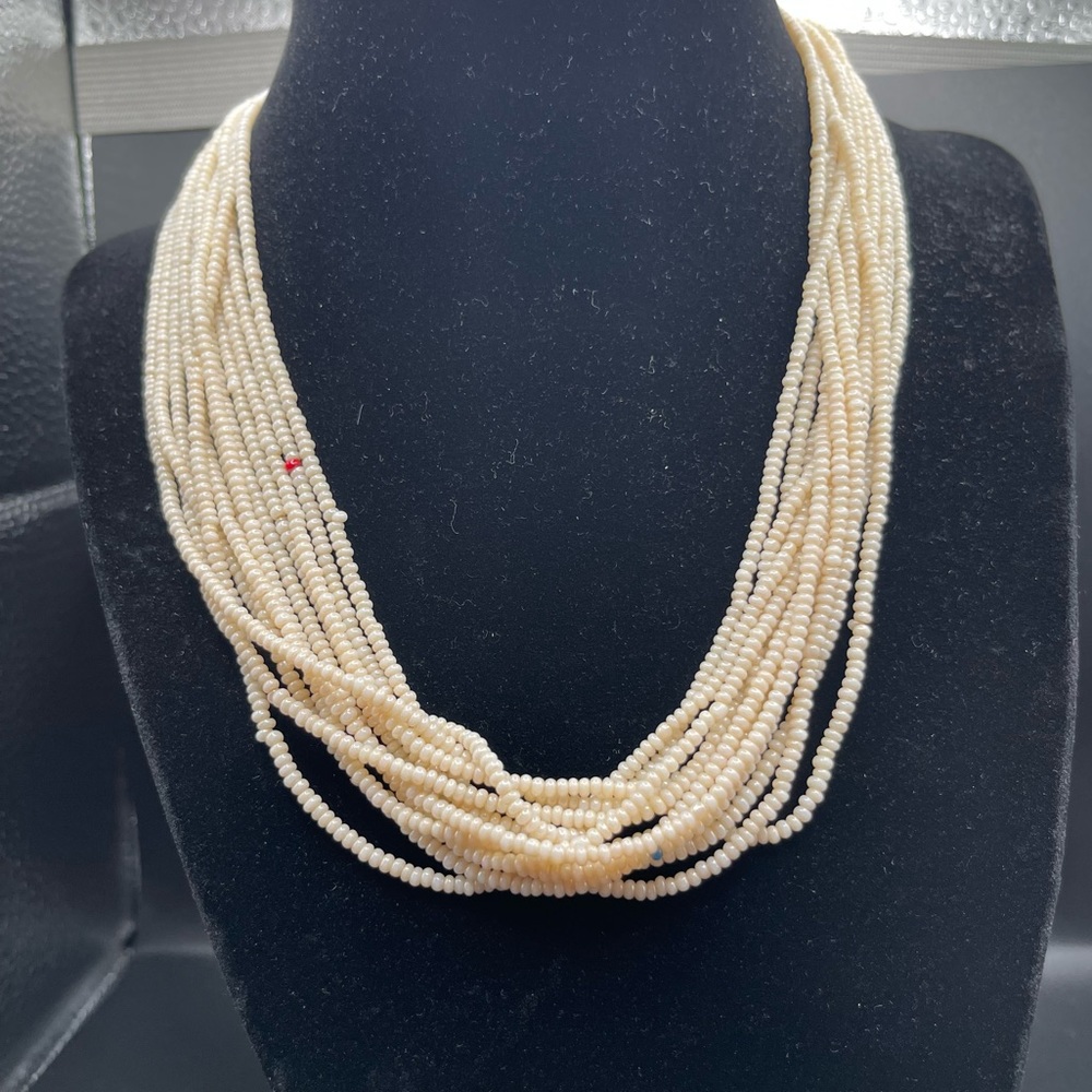 White layered beaded necklace with pops of color
